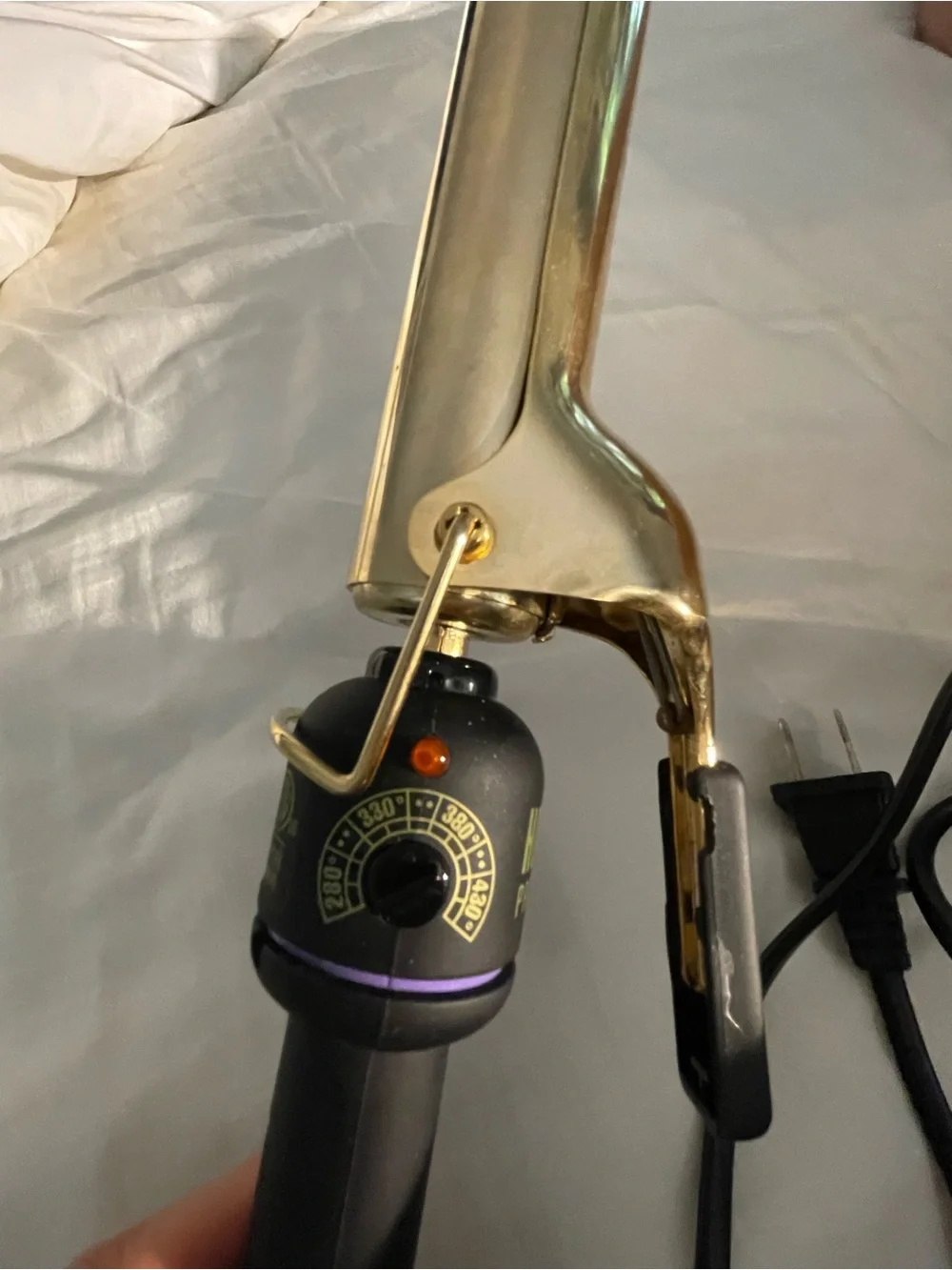 New in box with travel bag, Gold & Black 1 1/4” Long barrel pro curling iron.